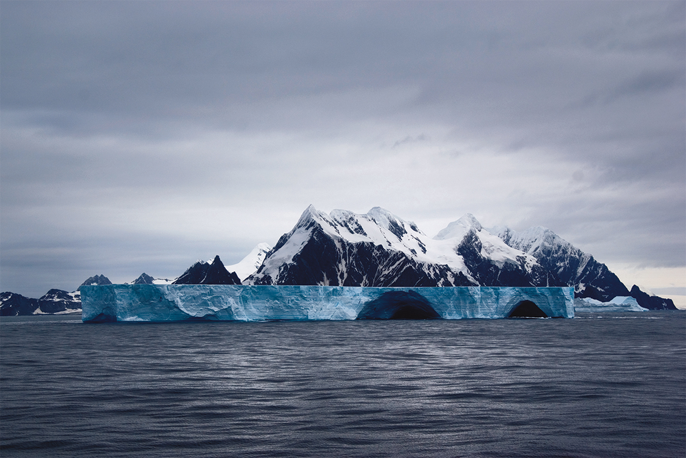 <p>Photo courtesy G Adventures’ own <a href="https://twitter.com/gadv_leolove">Leonardo Tamburri</a>.</p> Ice-covered mountains and floating icebergs off Elephant Island, Antarctica