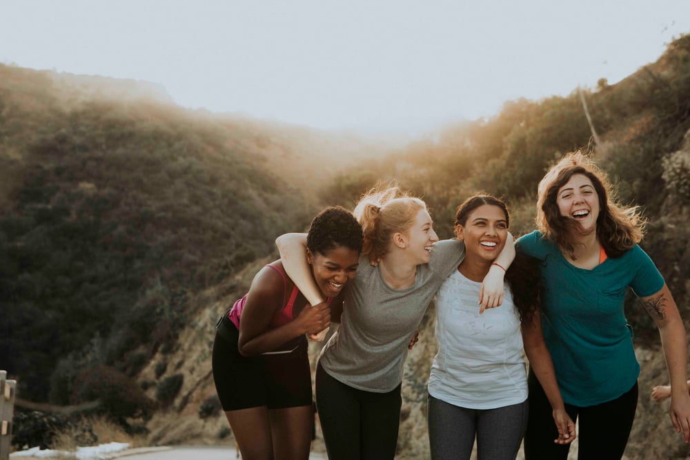 Four friends smiling and hanging out