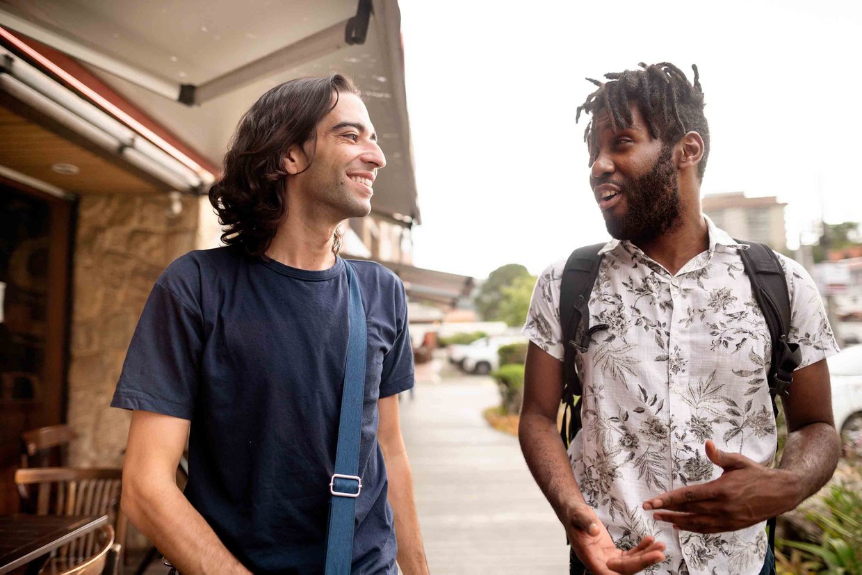 Two friends walking and talking