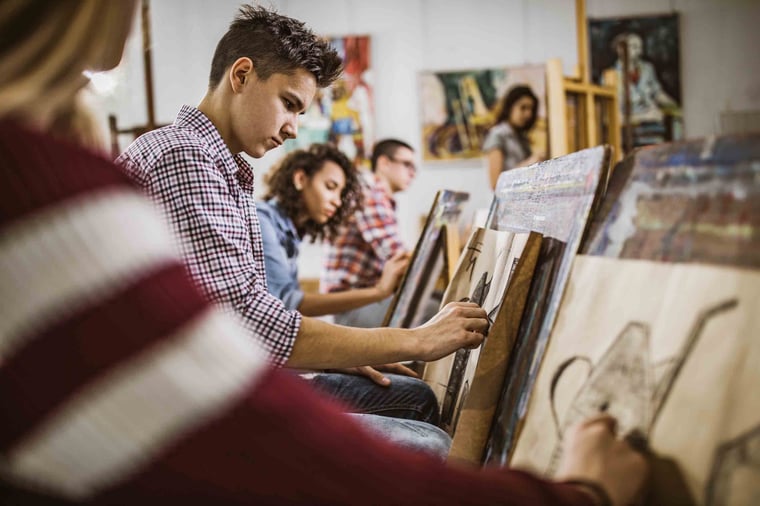 People drawing in art class